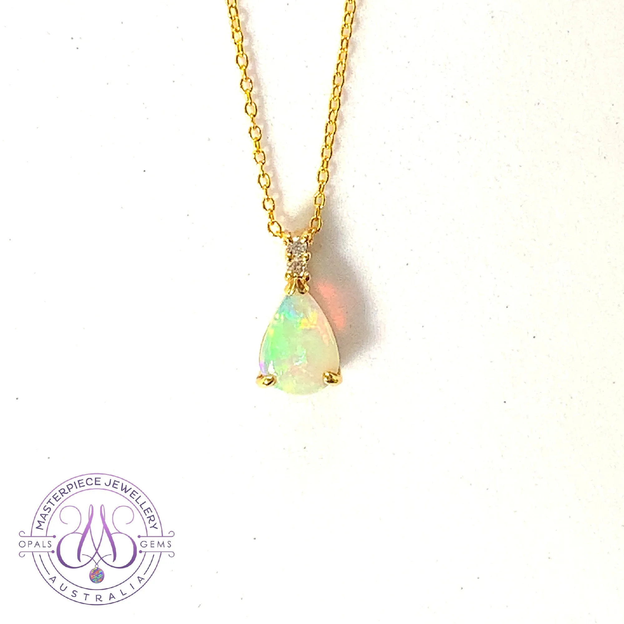 14kt Yellow Gold Pear shape 10x7mm Crystal Opal pendant