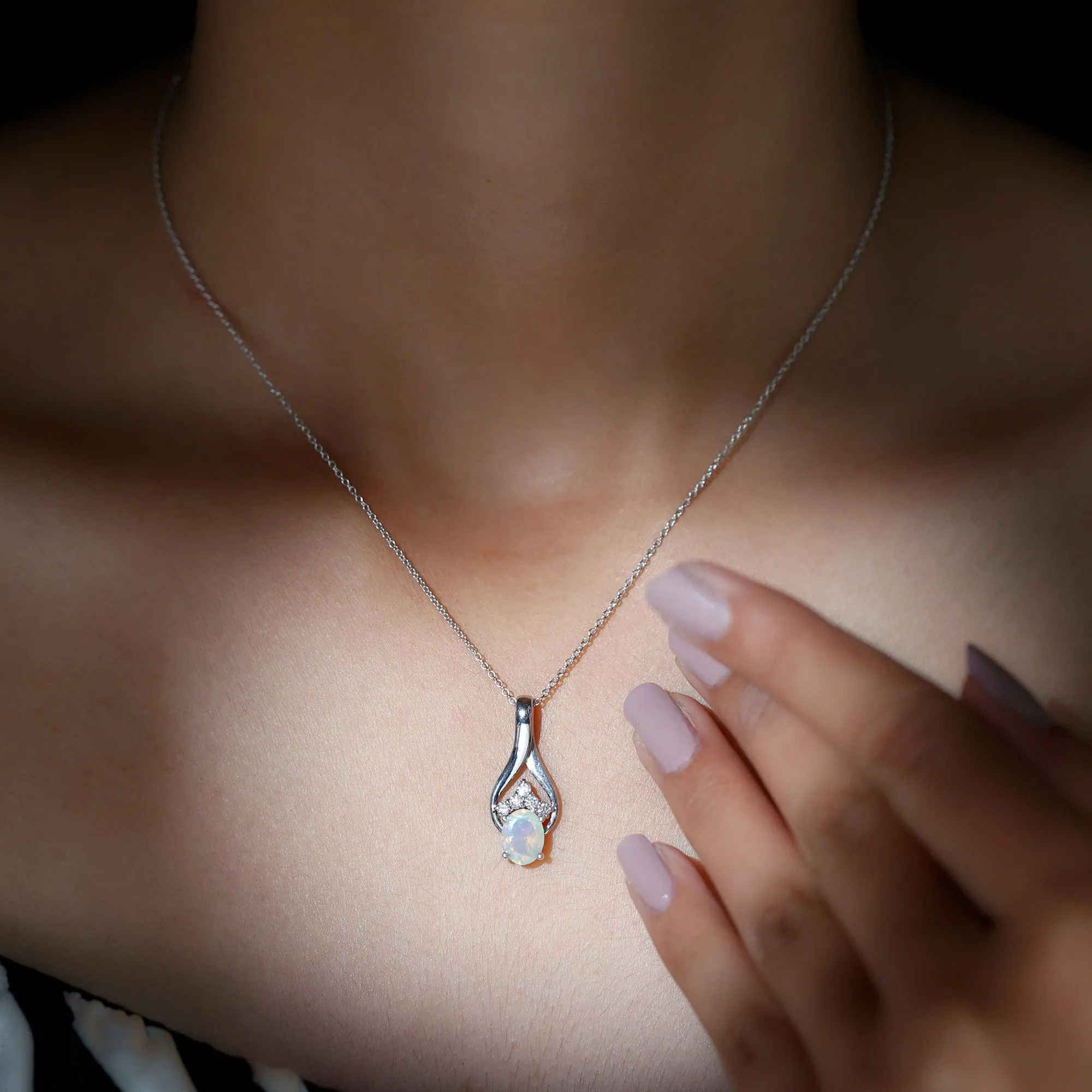 Oval Ethiopian Opal and Moissanite Silver Teardrop Pendant