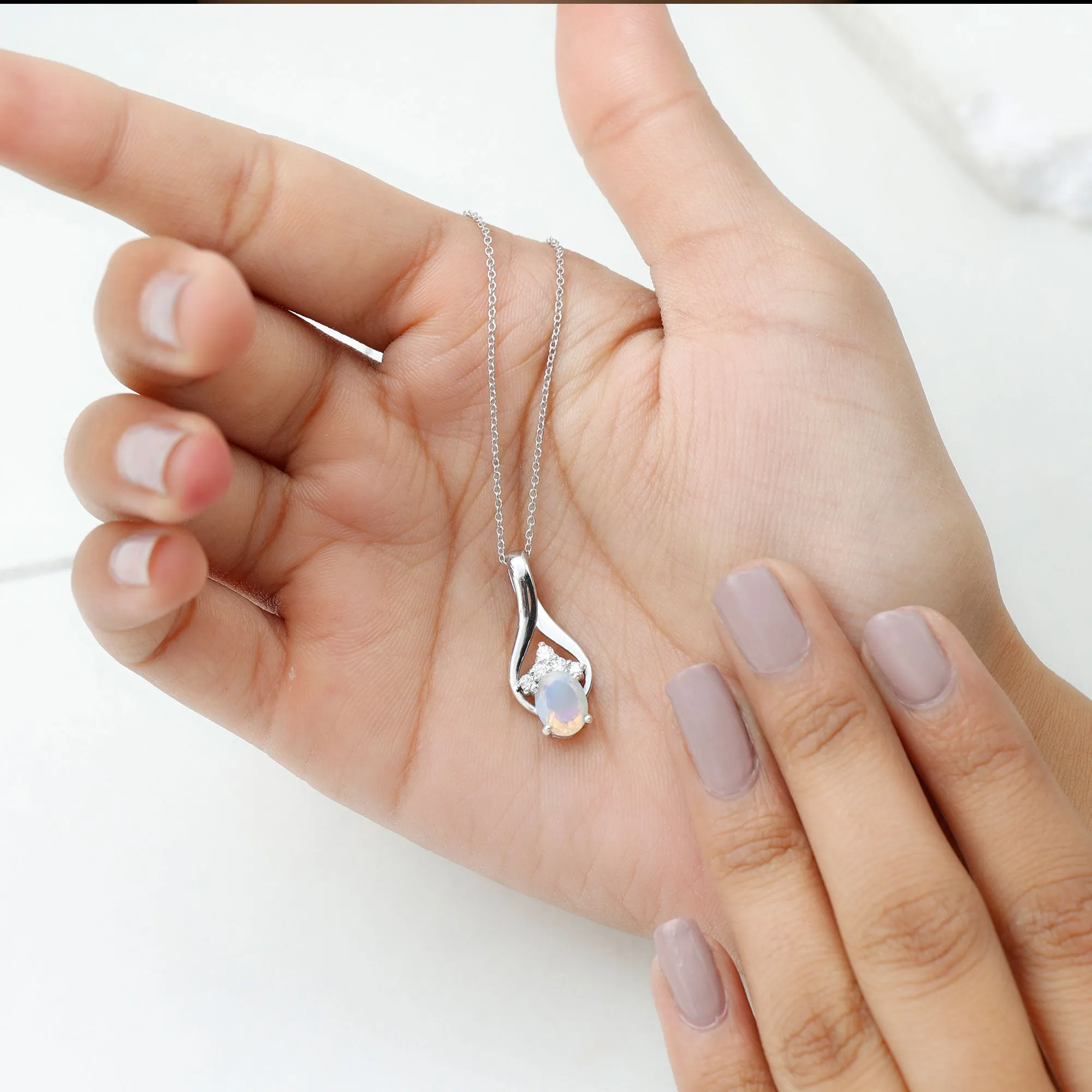 Oval Ethiopian Opal and Moissanite Silver Teardrop Pendant